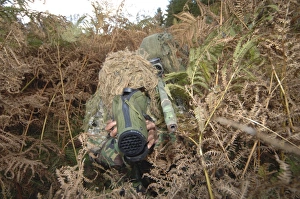 A British Army sniper team dressed in ghillie suits A British Army sniper team dressed in ghillie suits