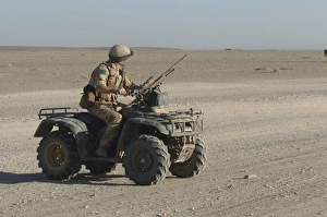 A British Army soldier provides security on a ATV A British Army soldier provides security on a ATV