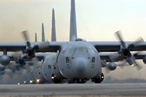 C-130 Hercules aircraft taxi out for a mission during a six-ship sortie C-130 Hercules aircraft taxi out for a mission during a six-ship sortie