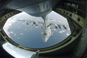 A C-130 Hercules is refueled by a KC-135 Stratotanker A C-130 Hercules is refueled by a KC-135 Stratotanker