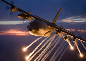 A C-130 Hercules releases flares during a mission over Kansas A C-130 Hercules releases flares during a mission over Kansas