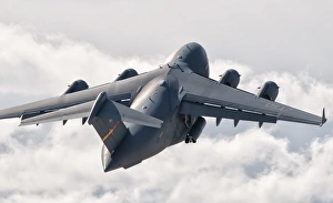 A C-17 Globemaster flying above the clouds over Nellis Air Force Base, Nevada A C-17 Globemaster flying above the clouds over Nellis Air Force Base, Nevada