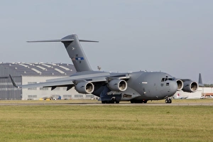 A C-17 Globemaster strategic transport aircraft taxiing on the runway A C-17 Globemaster strategic transport aircraft taxiing on the runway