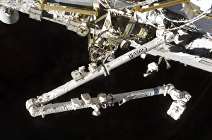 The Canadian-built space station remote manipulator system (Canadarm2), during undocking The Canadian-built space station remote manipulator system (Canadarm2), during undocking