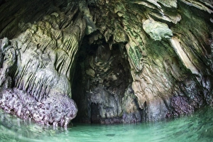 A cave has formed inside a limestone island in Raja Ampat A cave has formed inside a limestone island in Raja Ampat