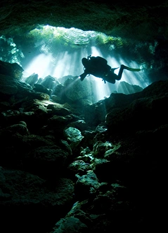 A cavern diver enters the Taj Mahal cenote system on Mexicos Yucatan Peninsula A cavern diver enters the Taj Mahal cenote system on Mexicos Yucatan Peninsula