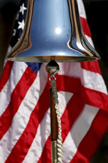 A ceremonial ships bell displayed during a dedication ceremony A ceremonial ships bell displayed during a dedication ceremony