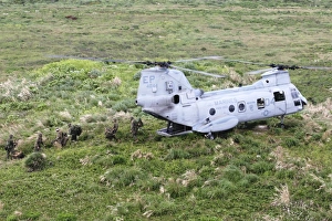 A CH-46 E Sea Knight helicopter drops off Marines A CH-46 E Sea Knight helicopter drops off Marines