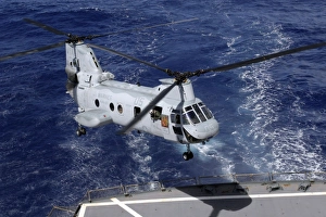 A CH-46 Sea Knight helicopter lands on the deck of the USS Pecos A CH-46 Sea Knight helicopter lands on the deck of the USS Pecos