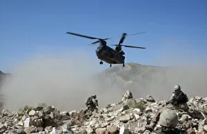 Images Dated 6th September 2004: Clouds of dust kicked up by the rotor wash of a CH-47 Chinook helicopter in Afghanistan