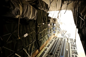 Container delivery system bundles drop out of a C-17 Globemaster III over a drop Container delivery system bundles drop out of a C-17 Globemaster III over a drop