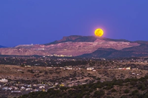 Copper moon rising over the Santa Rita Copper Mine in New Mexico Copper moon rising over the Santa Rita Copper Mine in New Mexico