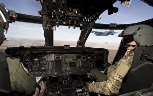The crew of an HH-60G Pave Hawk prepare to conduct aerial refueling The crew of an HH-60G Pave Hawk prepare to conduct aerial refueling