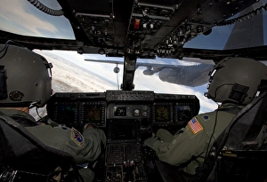 A CV-22 Osprey onducts aerial refueling with an HC-130 aircraft A CV-22 Osprey onducts aerial refueling with an HC-130 aircraft