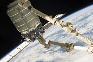 The Cygnus spacecraft in the grasp of Canadarm2 The Cygnus spacecraft in the grasp of Canadarm2