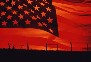 Digital composite of the American Flag over the countryside Digital composite of the American Flag over the countryside