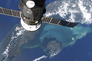 <b class=qtipBold><figcaption>The docked Progress 22 spacecraft</figcaption></b><br>August 28, 2006 - The docked Progress 22 spacecraft is featured in this image photographed by an Expedition 13 crewmember from a window on the International Space Station. Western Cuba provided the backdrop for the image.<br><em>© Stocktrek Images</em> The docked Progress 22 spacecraft