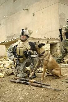 Images Dated 6th February 2007: A dog handler and his military working dog take a short break