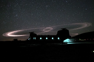 Dust lights up the rotors of a CH-47 Chinook helicopter Dust lights up the rotors of a CH-47 Chinook helicopter