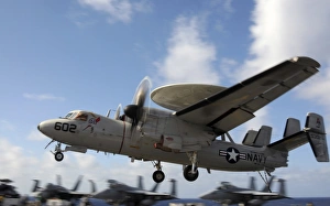 An E-2C Hawkeye lands aboard the aircraft carrier USS George H.W. Bush An E-2C Hawkeye lands aboard the aircraft carrier USS George H.W. Bush