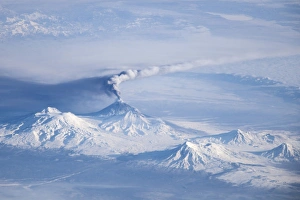 An eruption plume emanating from Kliuchevskoi volcano An eruption plume emanating from Kliuchevskoi volcano