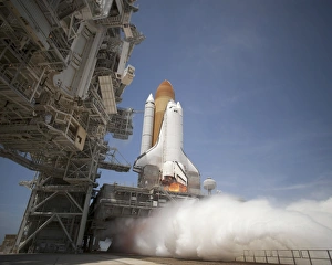 An exhaust plume forms under the mobile launcher platform on Launch Pad 39A as space An exhaust plume forms under the mobile launcher platform on Launch Pad 39A as space