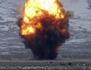 An explosion of more than 1, 000 pounds of explosives light up the sky An explosion of more than 1, 000 pounds of explosives light up the sky