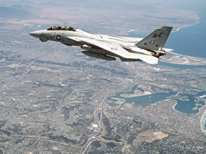 An F-14A Tomcat cruises above San Diego, California An F-14A Tomcat cruises above San Diego, California