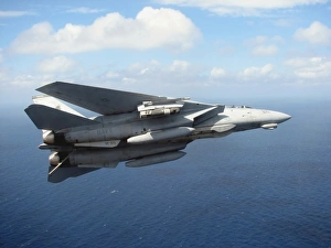 An F-14D Tomcat banks with its tailhook lowered in preparation for landing An F-14D Tomcat banks with its tailhook lowered in preparation for landing