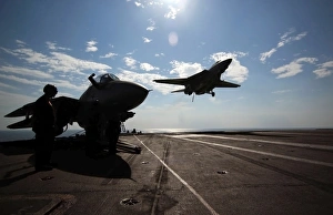 An F-14D Tomcat prepares to make an arrested landing aboard USS Theodore Roosevelt An F-14D Tomcat prepares to make an arrested landing aboard USS Theodore Roosevelt