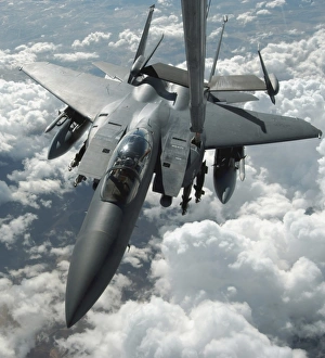 An F-15 E Strike Eagle receives fuel from a KC-10 Extender An F-15 E Strike Eagle receives fuel from a KC-10 Extender