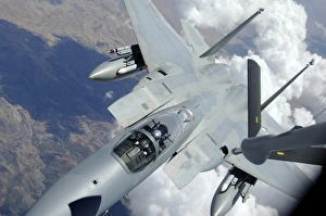 An F-15 Eagle pulls away from a KC-135 Stratotanker after refueling An F-15 Eagle pulls away from a KC-135 Stratotanker after refueling