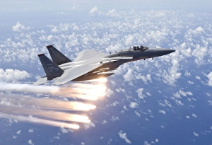An F-15 Eagle releases flares over the Pacific Ocean An F-15 Eagle releases flares over the Pacific Ocean