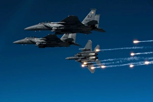 A F-15E Strike Eagle aircraft releases flares A F-15E Strike Eagle aircraft releases flares