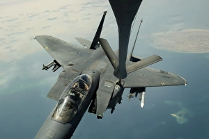An F-15E Strike Eagle receives fuel from a KC-135R Stratotanker An F-15E Strike Eagle receives fuel from a KC-135R Stratotanker