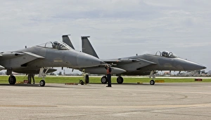 Two F-15s parked at the end of runway at Kadena Air Base, Japan Two F-15s parked at the end of runway at Kadena Air Base, Japan