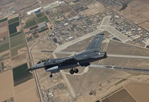 An F-16 Fighting Falcon in flight over Luke Air Force Base, Arizona An F-16 Fighting Falcon in flight over Luke Air Force Base, Arizona