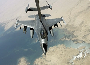 An F-16 Fighting Falcon refuels from a KC-10 Extender An F-16 Fighting Falcon refuels from a KC-10 Extender