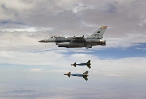 An F-16 Fighting Falcon releases two GBU-24 laser guided bombs An F-16 Fighting Falcon releases two GBU-24 laser guided bombs