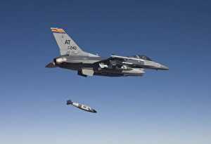 An F-16 Fighting Falcon releases a GBU-38 JDAM during a test mission An F-16 Fighting Falcon releases a GBU-38 JDAM during a test mission