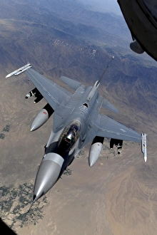 An F-16 Fighting Falcon returns to mission after refueling from a KC-135 Stratotanker An F-16 Fighting Falcon returns to mission after refueling from a KC-135 Stratotanker