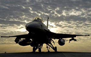 An F-16 Fighting Falcon sits tethered to the hot cargo pad at Joint Base Balad, Iraq An F-16 Fighting Falcon sits tethered to the hot cargo pad at Joint Base Balad, Iraq