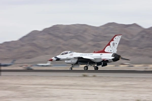 An F-16C Thunderbird sits on the runway at Nellis Air Force Base, Nevada An F-16C Thunderbird sits on the runway at Nellis Air Force Base, Nevada