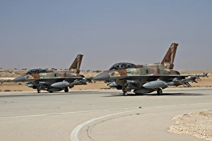 Two F-16I Sufa aircraft of the Israeli Air Force taxiing on the runway Two F-16I Sufa aircraft of the Israeli Air Force taxiing on the runway