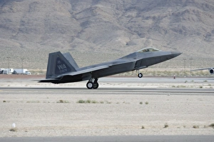 An F-22 Raptor landing on the runway at Nellis Air Force Base An F-22 Raptor landing on the runway at Nellis Air Force Base