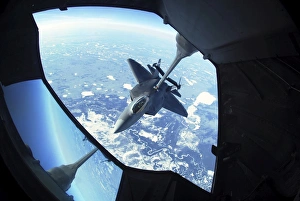 A F-22 Raptor refuels behind a KC-10 Extender A F-22 Raptor refuels behind a KC-10 Extender