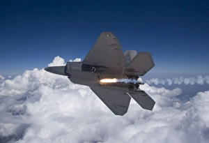 An F-22 Raptor releases a flare during a training mission An F-22 Raptor releases a flare during a training mission
