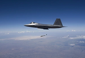 An F-22 Raptor releases a GBU-32 JDAM over New Mexico An F-22 Raptor releases a GBU-32 JDAM over New Mexico