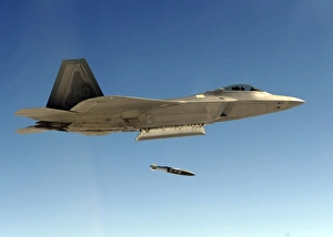 An F-22A Raptor drops a GBU-32 bomb An F-22A Raptor drops a GBU-32 bomb