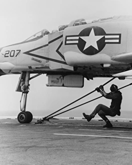 An F-4B Phantom II fighter plane is readied for launch from USS Coral Sea, 1969 An F-4B Phantom II fighter plane is readied for launch from USS Coral Sea, 1969